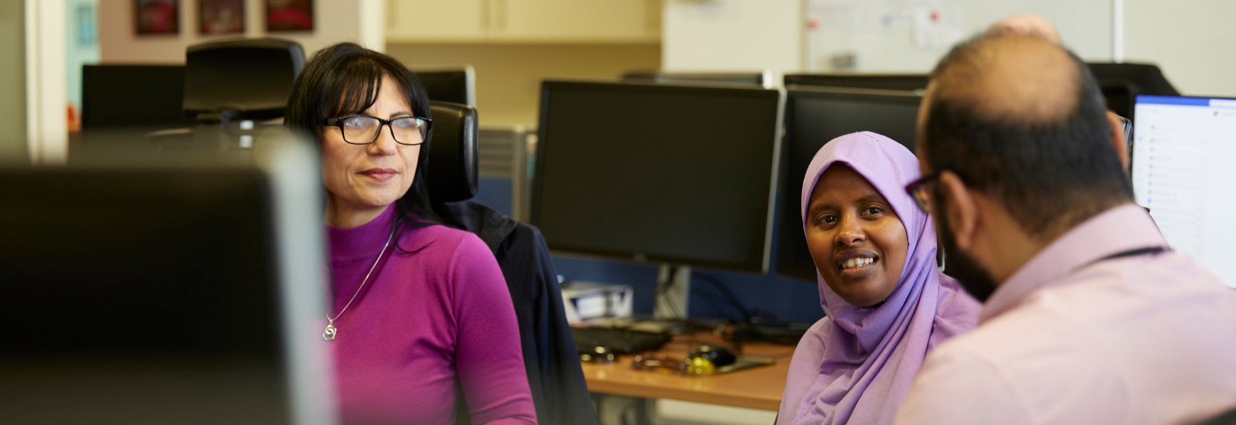 3 PPF colleagues sat near desks talking