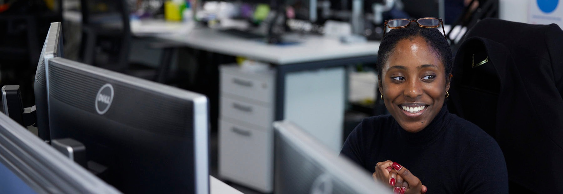 PPF colleague smiling at desk
