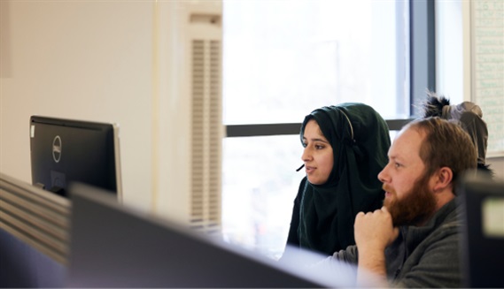 2 PPF colleague looking at monitor