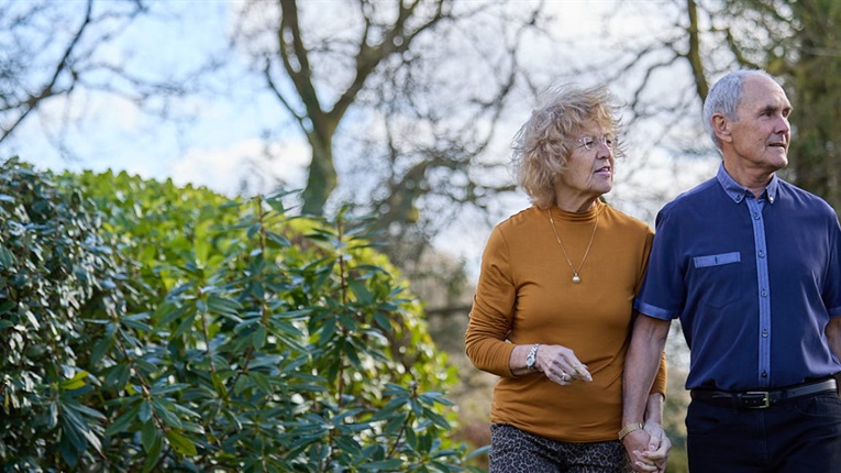 PPF member and her husband walking in their garden