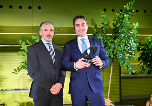 PPF colleague collecting trophy on stage