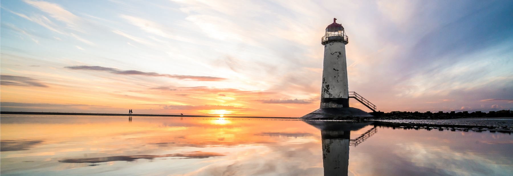 Image of a lighthouse at sunset.