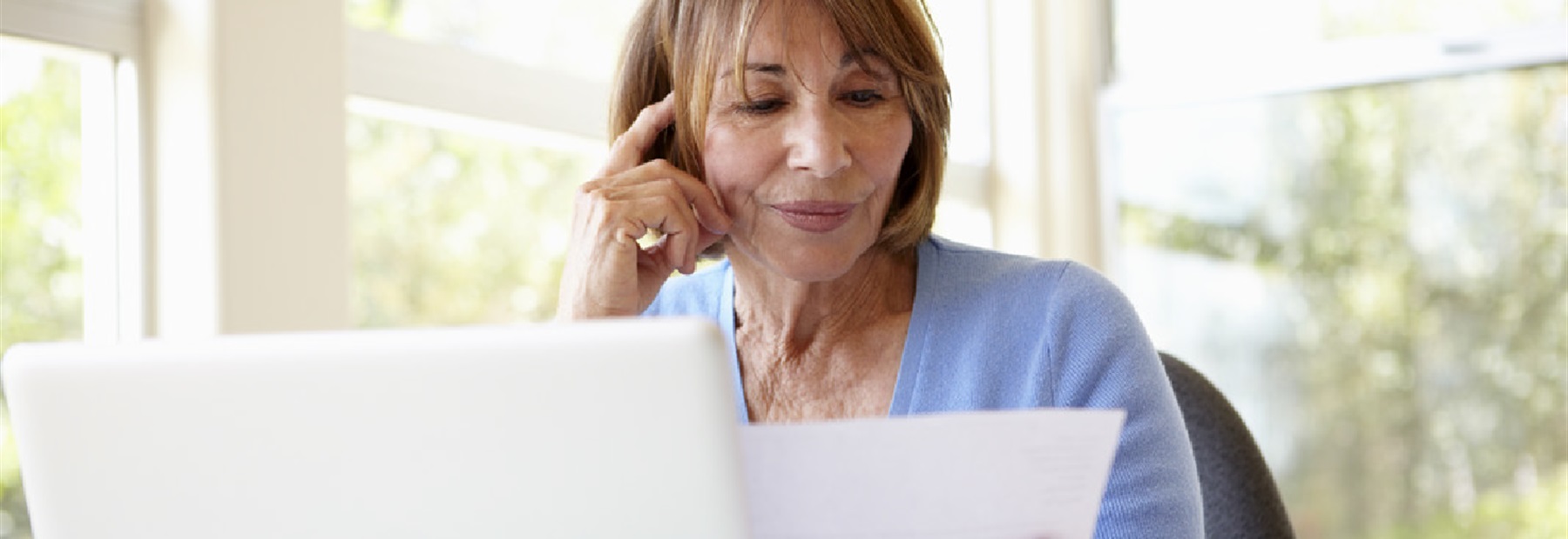 A lady sitting at a laptop